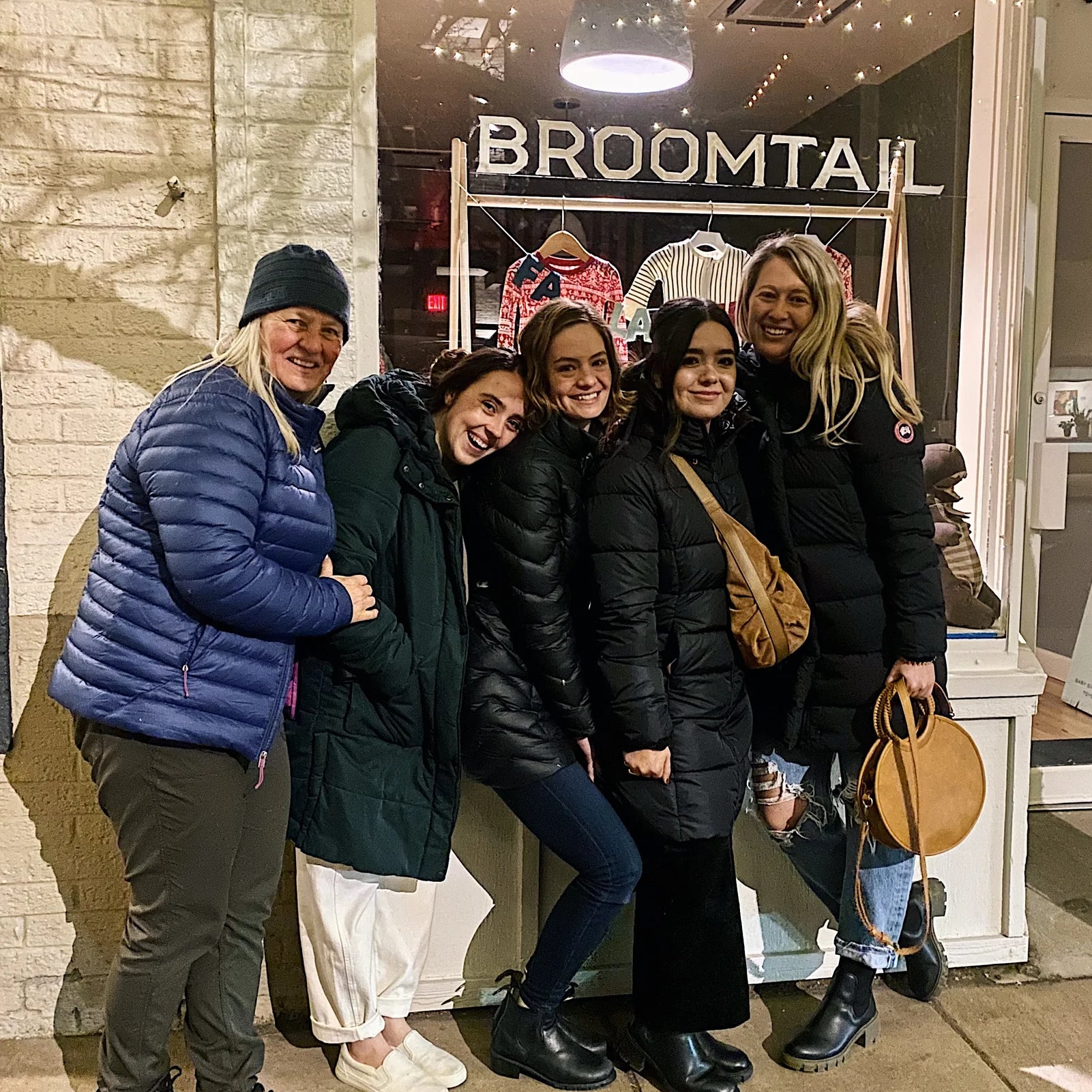 Women gathered outside of a Broomtail storefront after an event