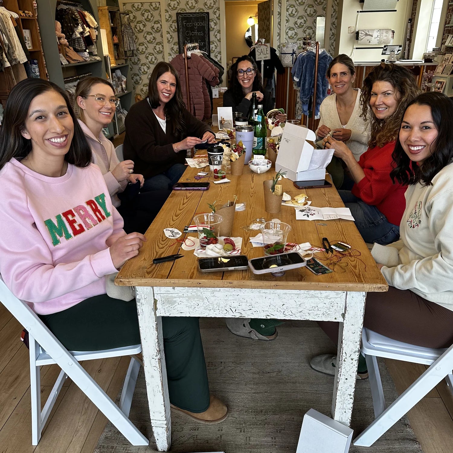 Women gathered around a table at a Broomtail event