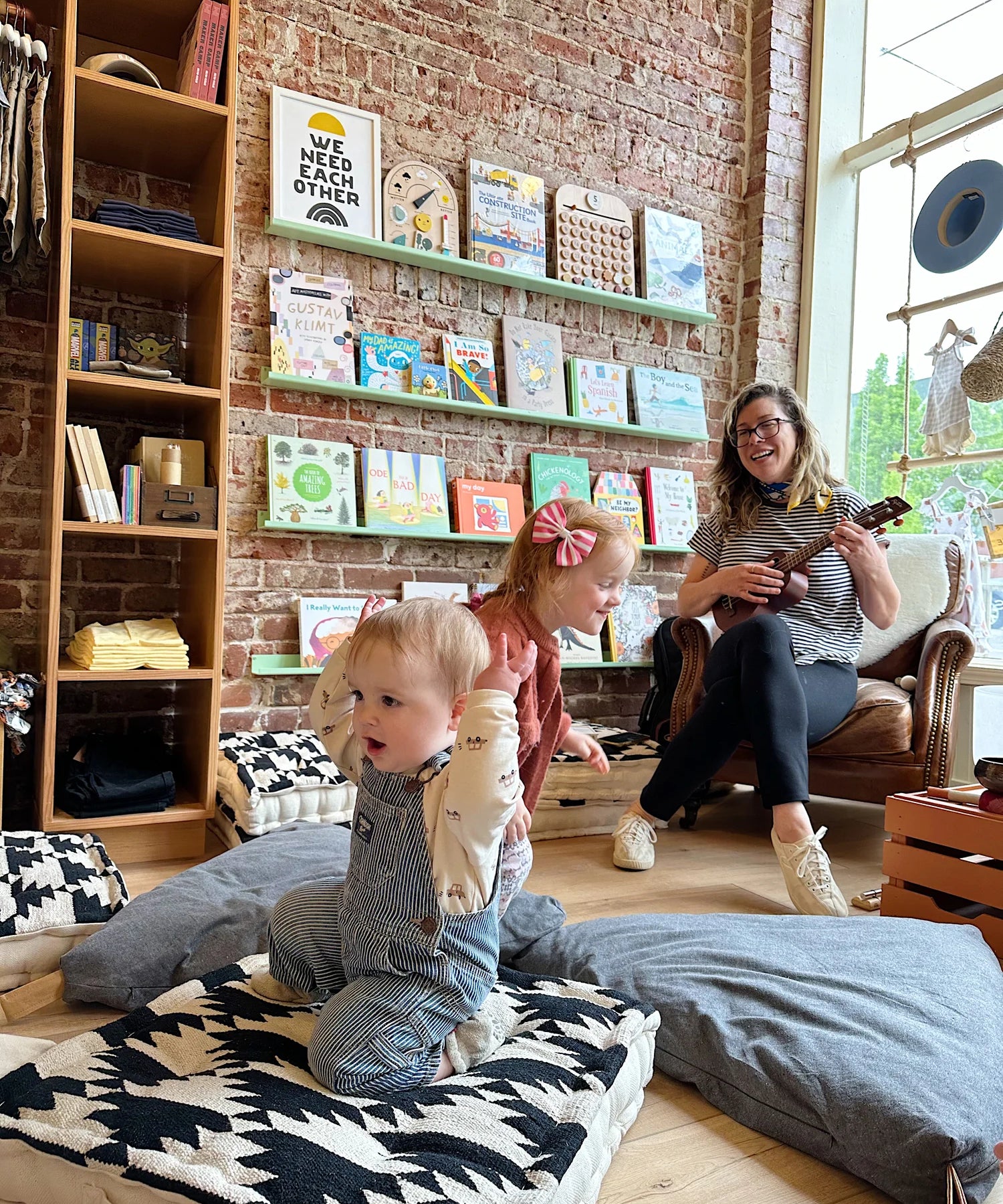 Children's boutique reading nook at a Broomtail community event