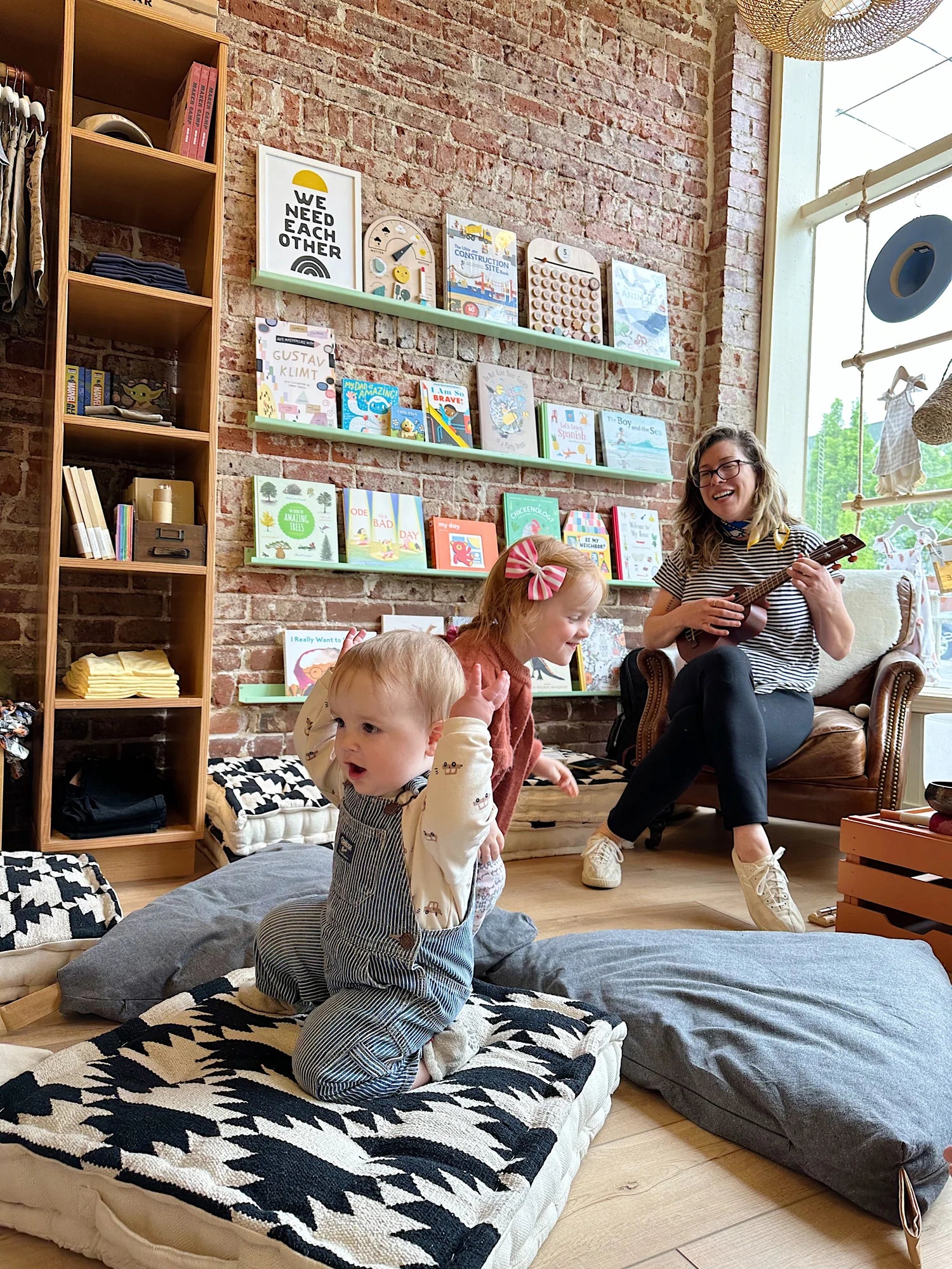 Children's boutique reading nook at a Broomtail community event