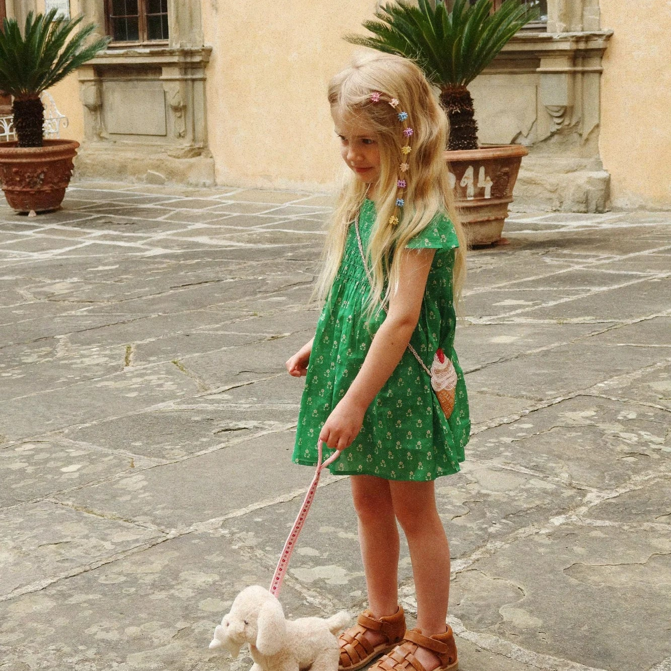 Kids green dress available as one of many pieces of ethically sourced children's clothing at Broomtail.